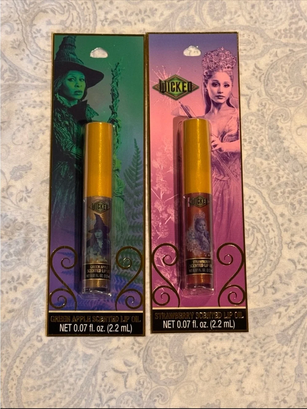 Wicked Scented Lip Oil Duo – Elphaba Green Apple & Glinda Strawberry